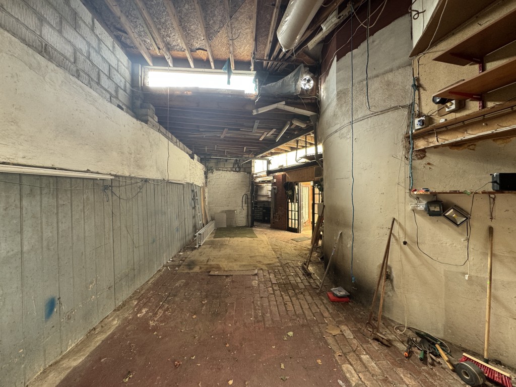 Lot: 178 - DETACHED COTTAGE FOR IMPROVEMENT AND REPAIR WITH LARGE GARAGE - Workshop from shutter